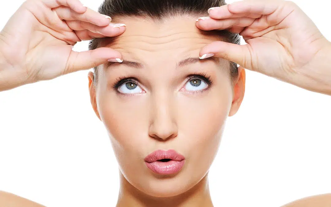 female face with wrinkles on her forehead