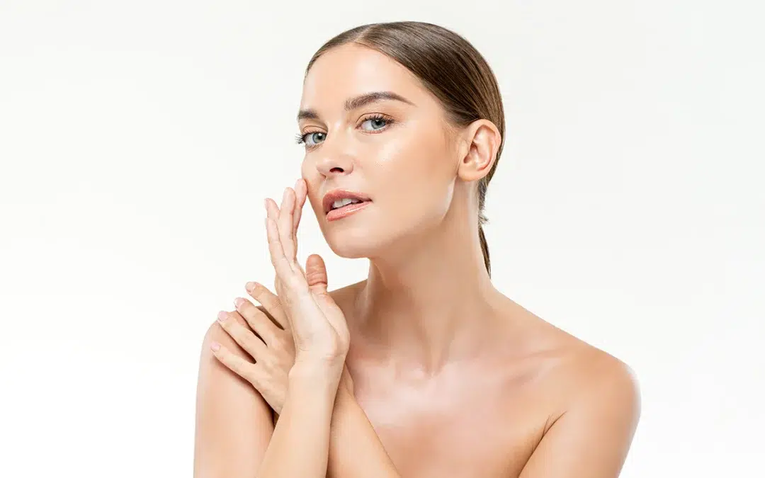 smooth fresh glowing skin woman touching her face