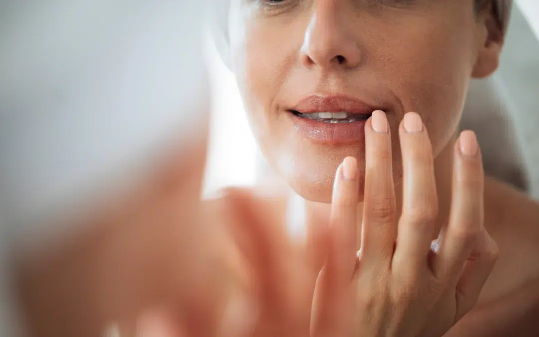 woman touching her lips