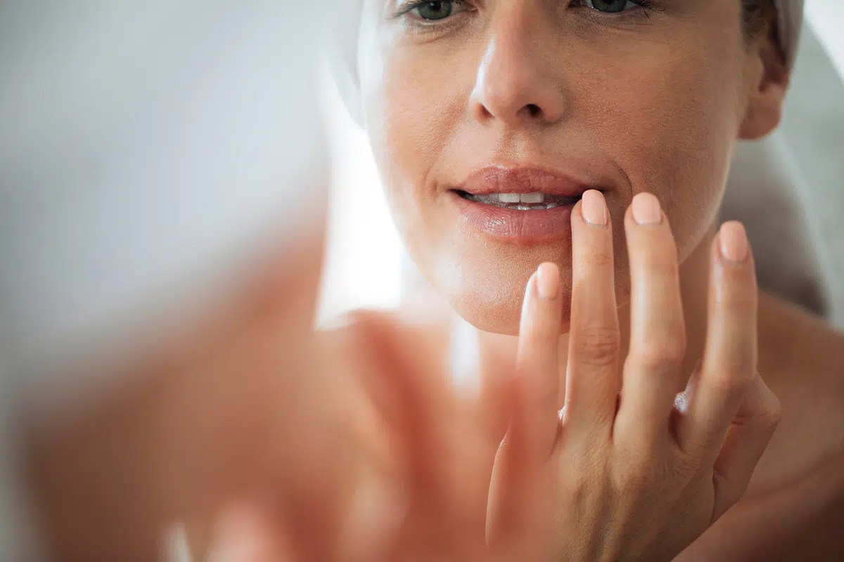 woman touching her lips