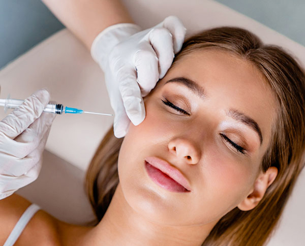 Younger woman getting facial injection