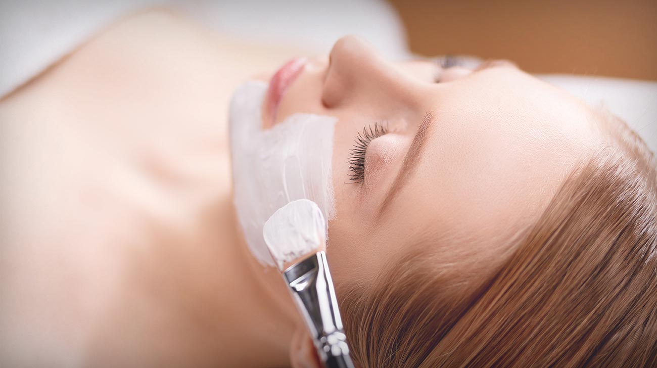 Spa facial mask application. Spa beauty organic facial mask application at day spa salon