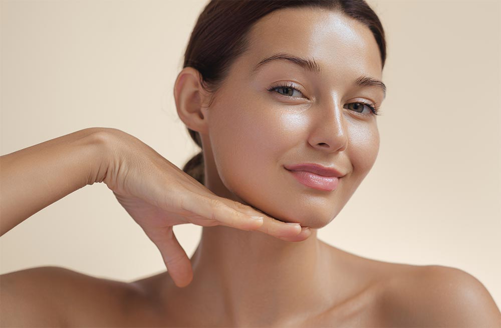 Beauty Photo of Woman with Clean and Healthy Skin Touching Her Face