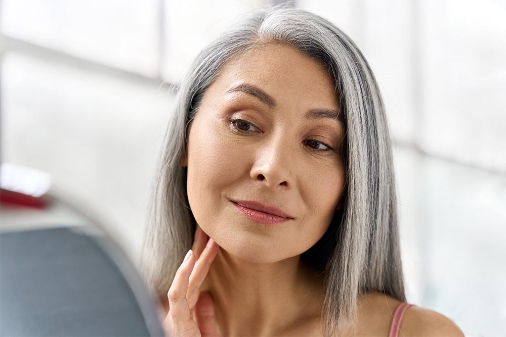 Portrait of gorgeous happy middle aged mature asian woman
