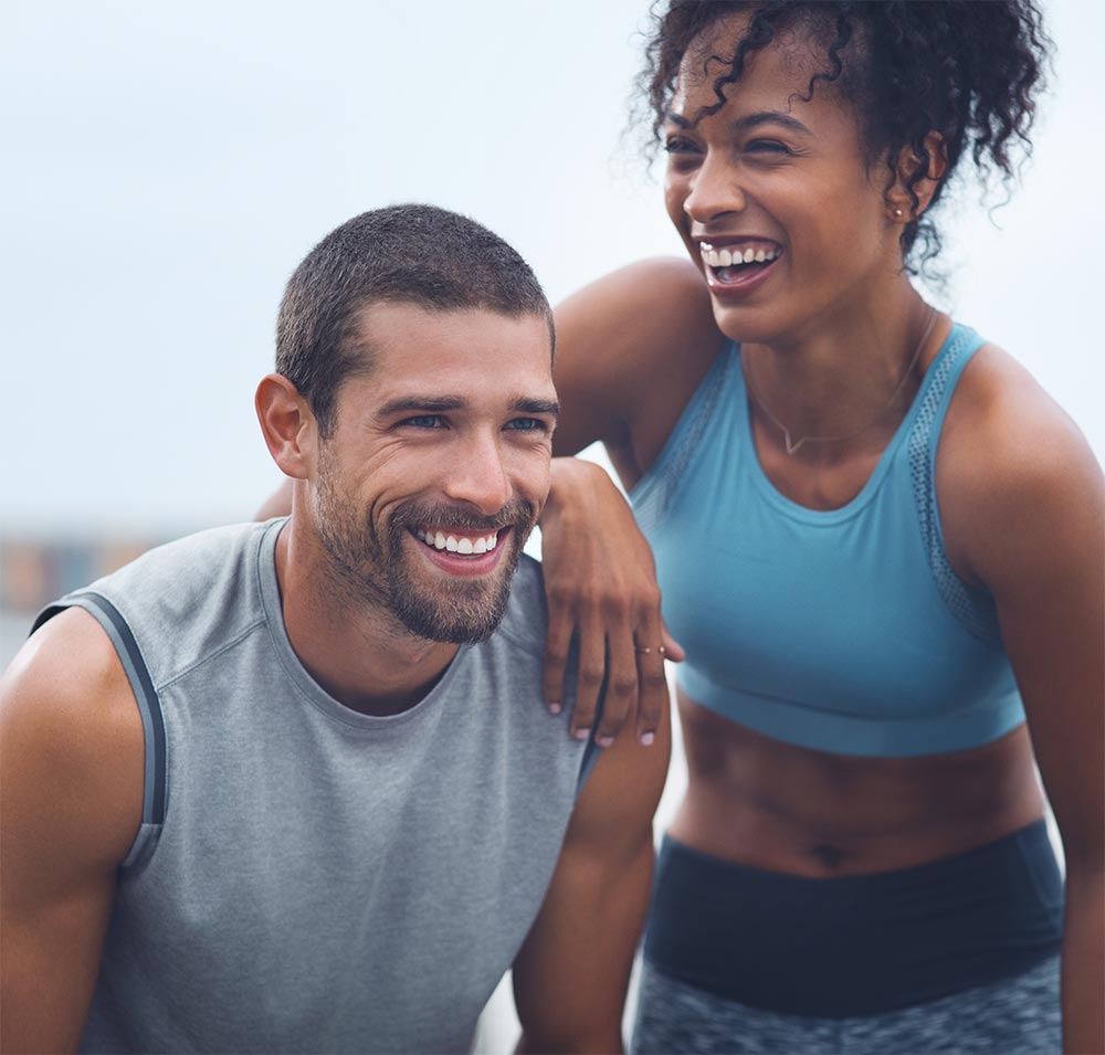 The journey were taking has been so rewarding. Shot of a sporty young couple taking a break while exercising outdoors.