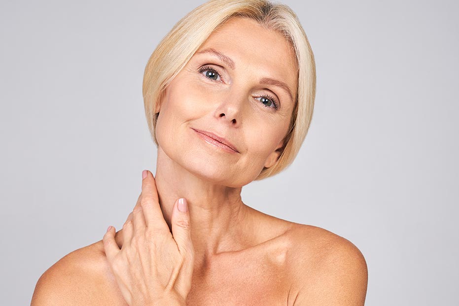 Cute mature lady is enjoying her perfect skin.