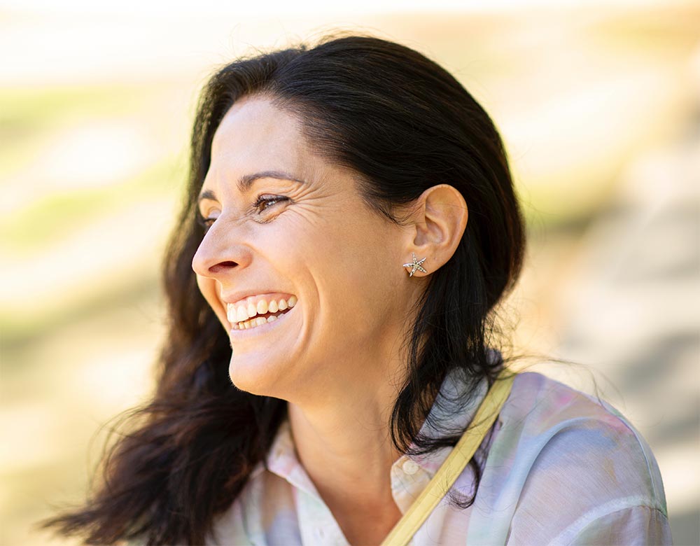 Portrait of joyful caucasian woman laughing