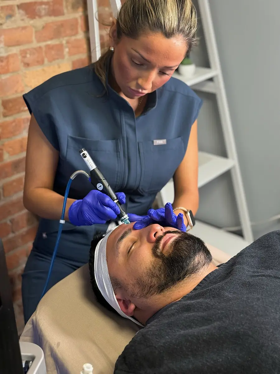 Top Winter Skincare Treatments male patient receiving hydrafacial and dermaplaning treatments
